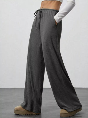 Dark gray ribbed wide-leg pants with drawstring and pockets