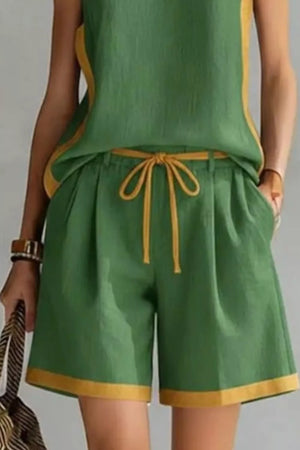 Green tank and shorts set with contrast trim and drawstring waist.