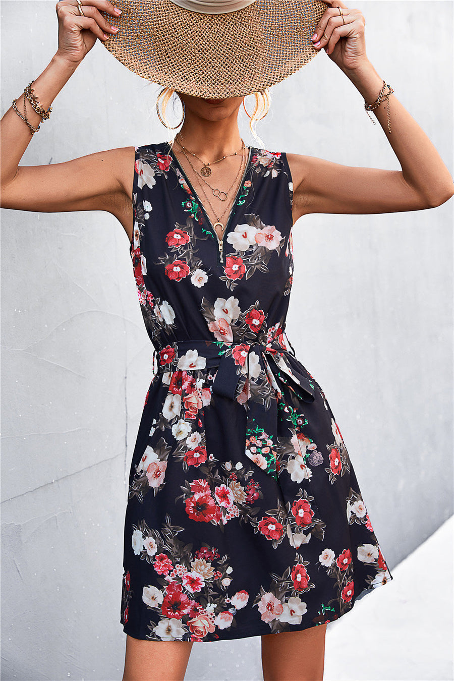 Black floral zip-front mini dress with tie waist and V-neck
