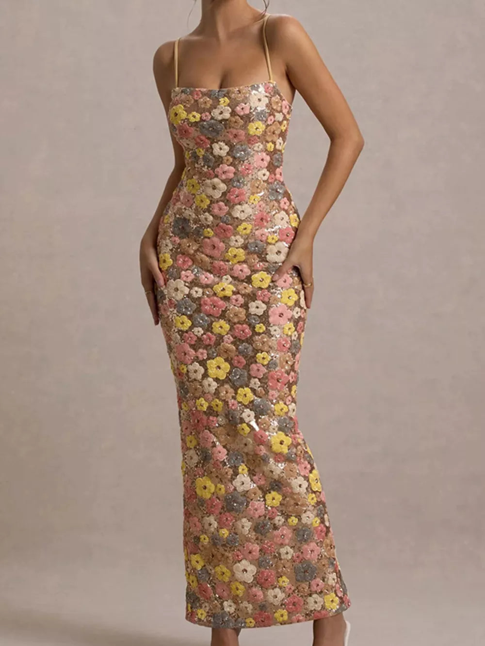 Floral sequin maxi dress with spaghetti straps and a bodycon fit.