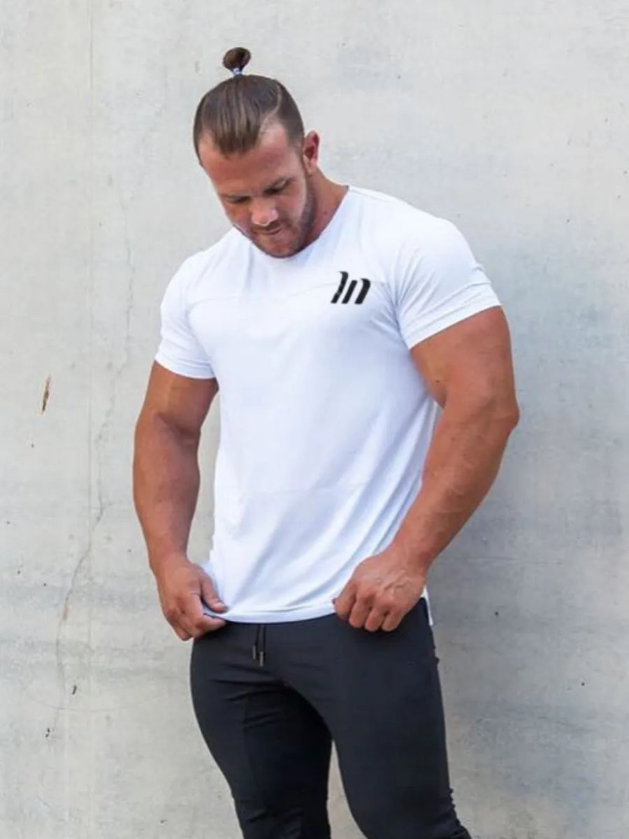 White performance fit raglan tee with black logo detail.
