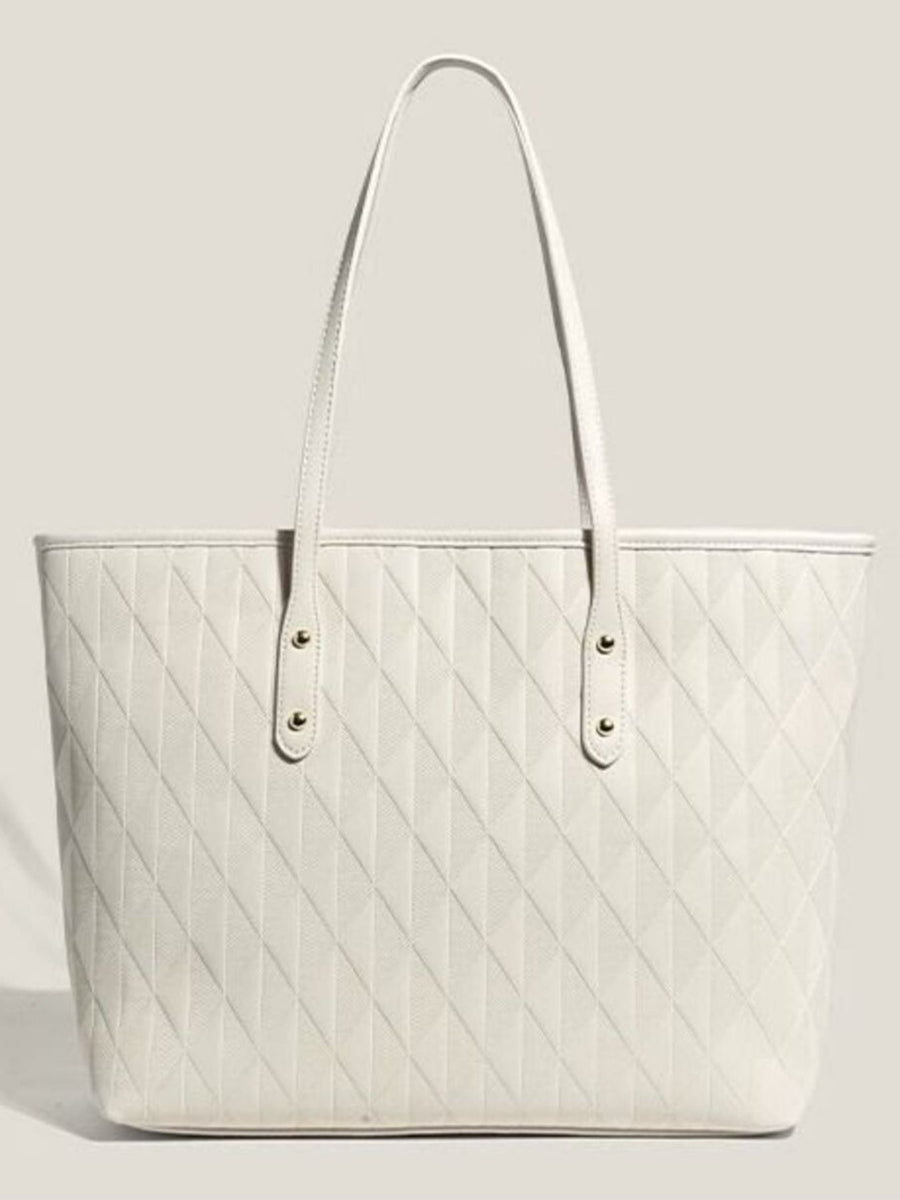 White quilted pu leather tote bag with diamond pattern and gold stud details.