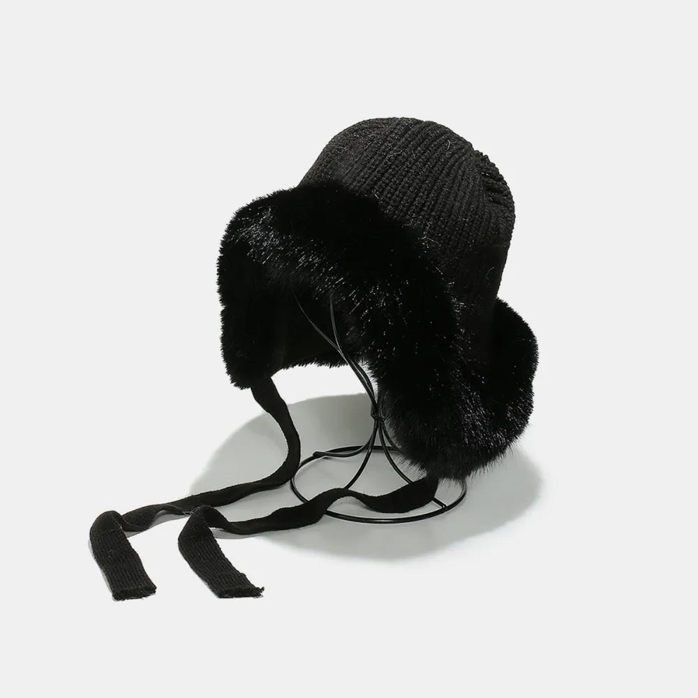 Black trapper hat with faux fur trim and tie straps
