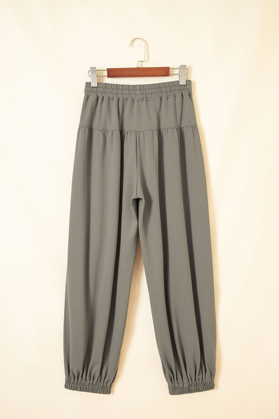 wide-leg pants in sage green with drawstring waist and full-length