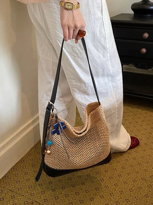 shoulder bag in black with woven and woven texture