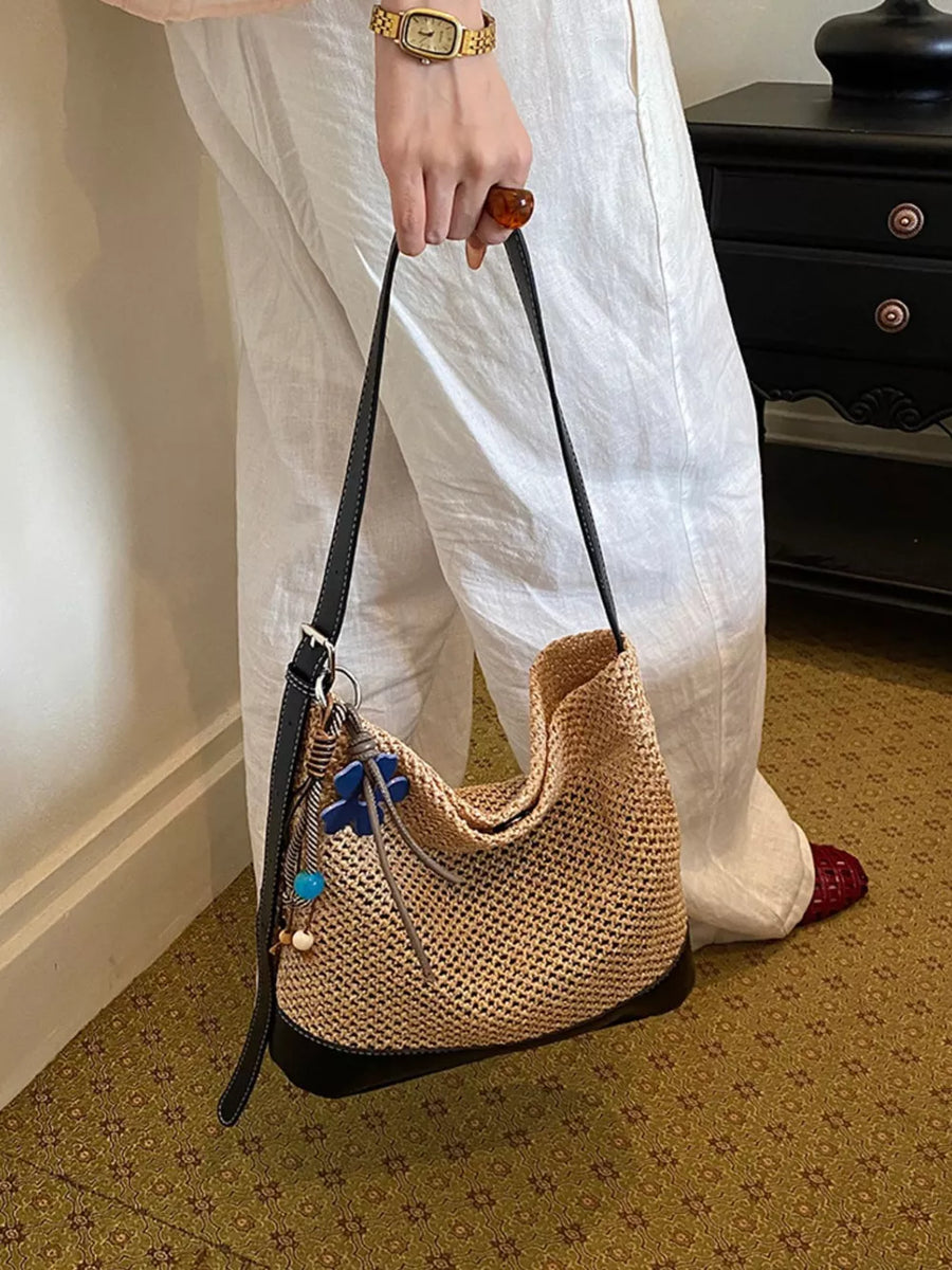 shoulder bag in black with woven and woven texture