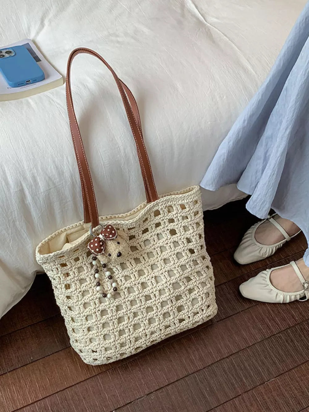 handbag in cream featuring woven construction and tote fit
