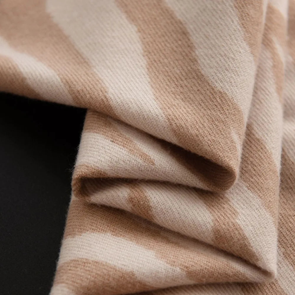 Zebra stripe wool scarf in khaki with fringed edges.
