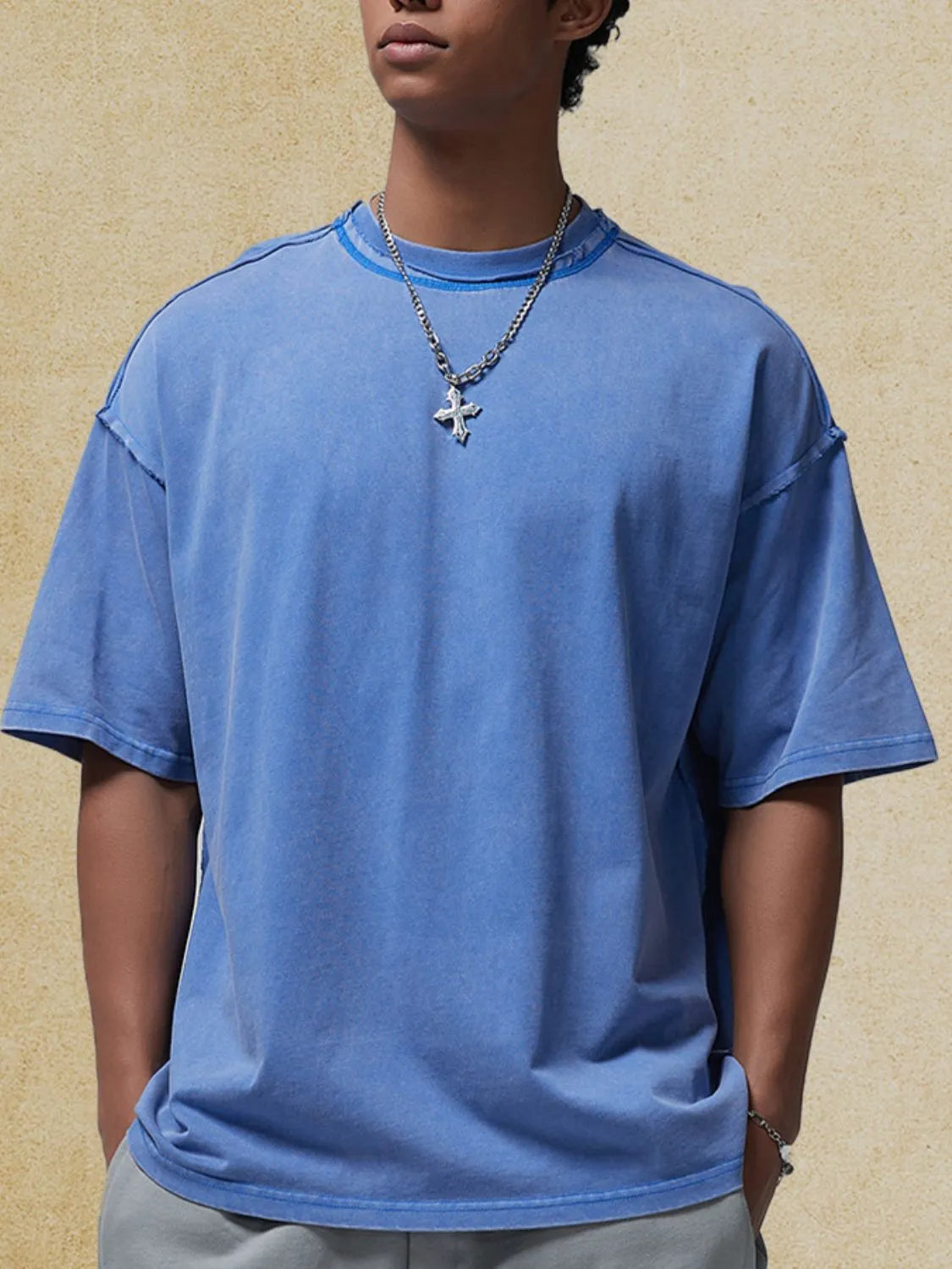 Blue washed cotton t-shirt with raw seams and crew neck