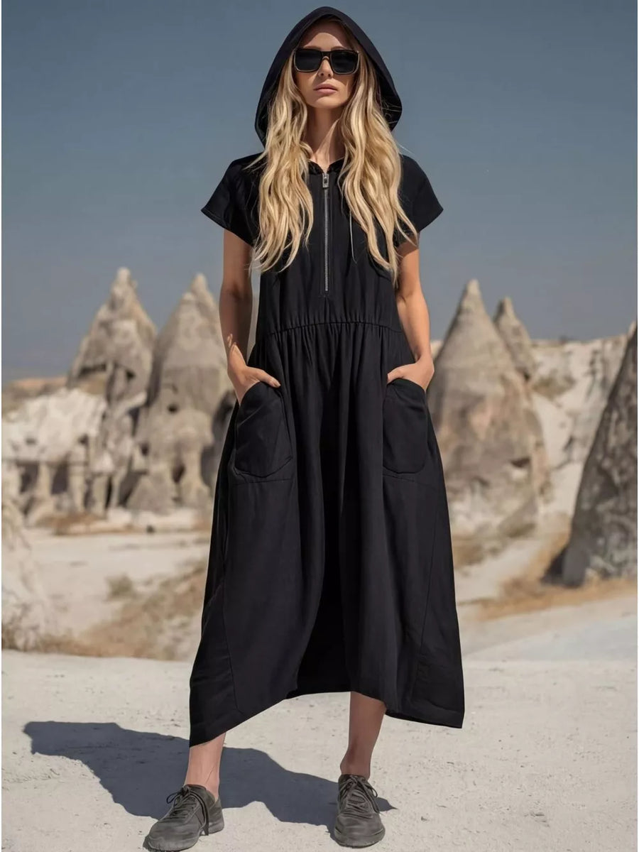 Black hooded midi dress with short sleeves, zip neckline, elastic waist, and functional pockets.