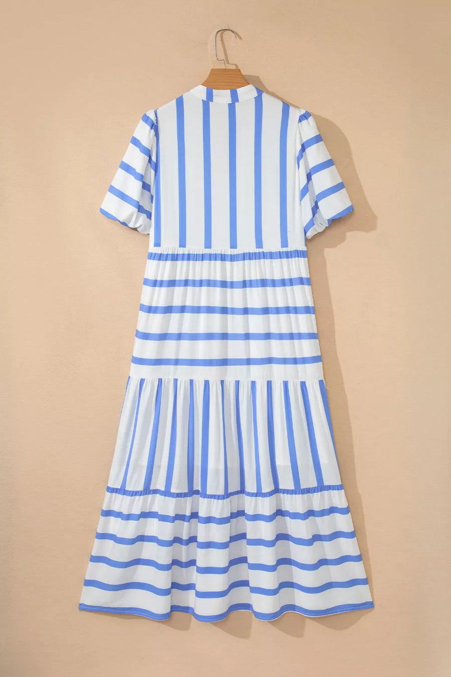 Tiered white and blue striped midi dress with short sleeves and ruffled hem.