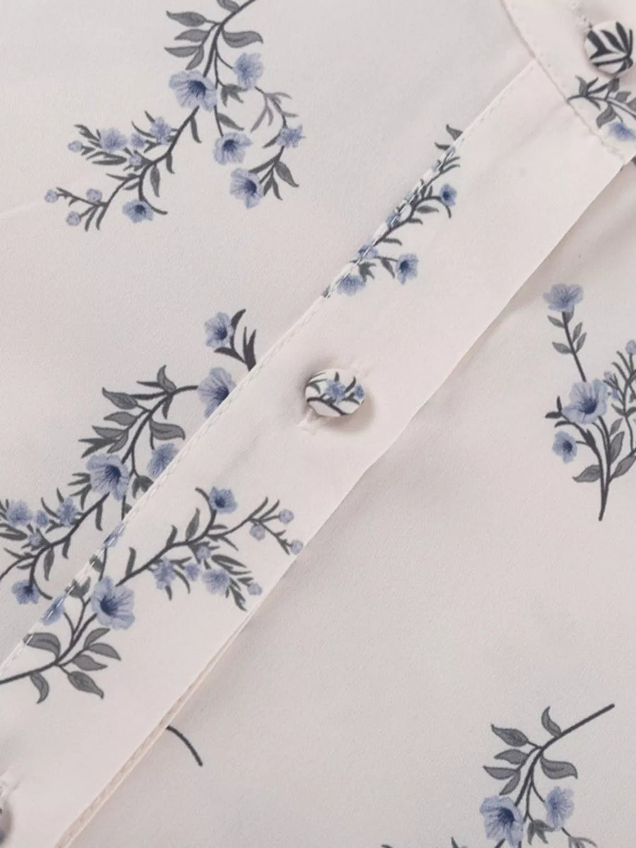 White blouse with blue floral print and button detail