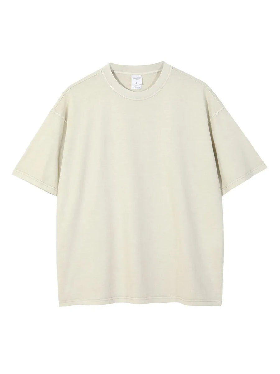 Oversized washed cotton tee in beige with a relaxed fit and crew neck.