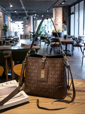 PU Leather Imported Size &amp crossbody bag in Caramel with structured bucket silhouette