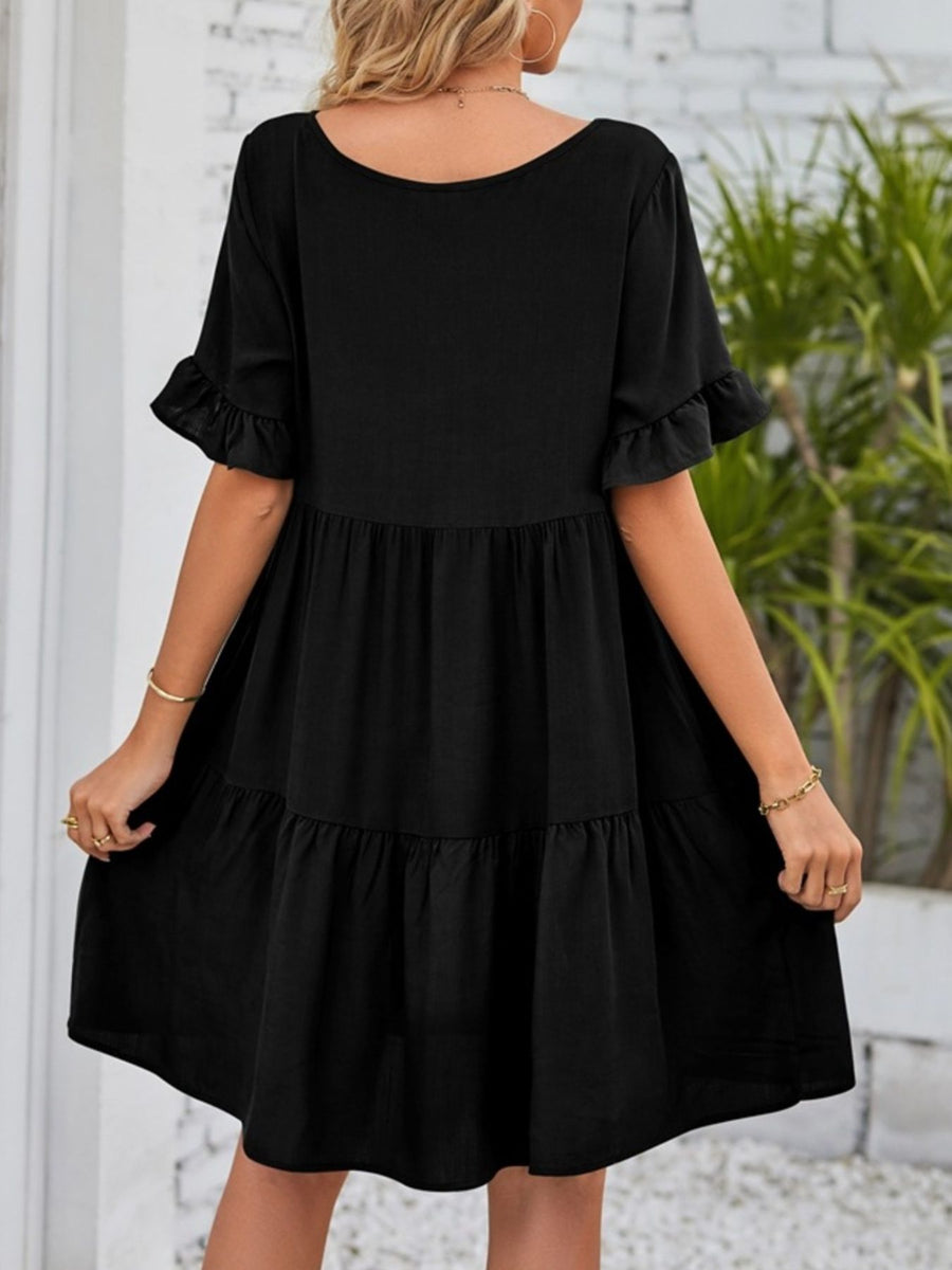Black ruffled sleeve mini dress with tiered skirt and pockets