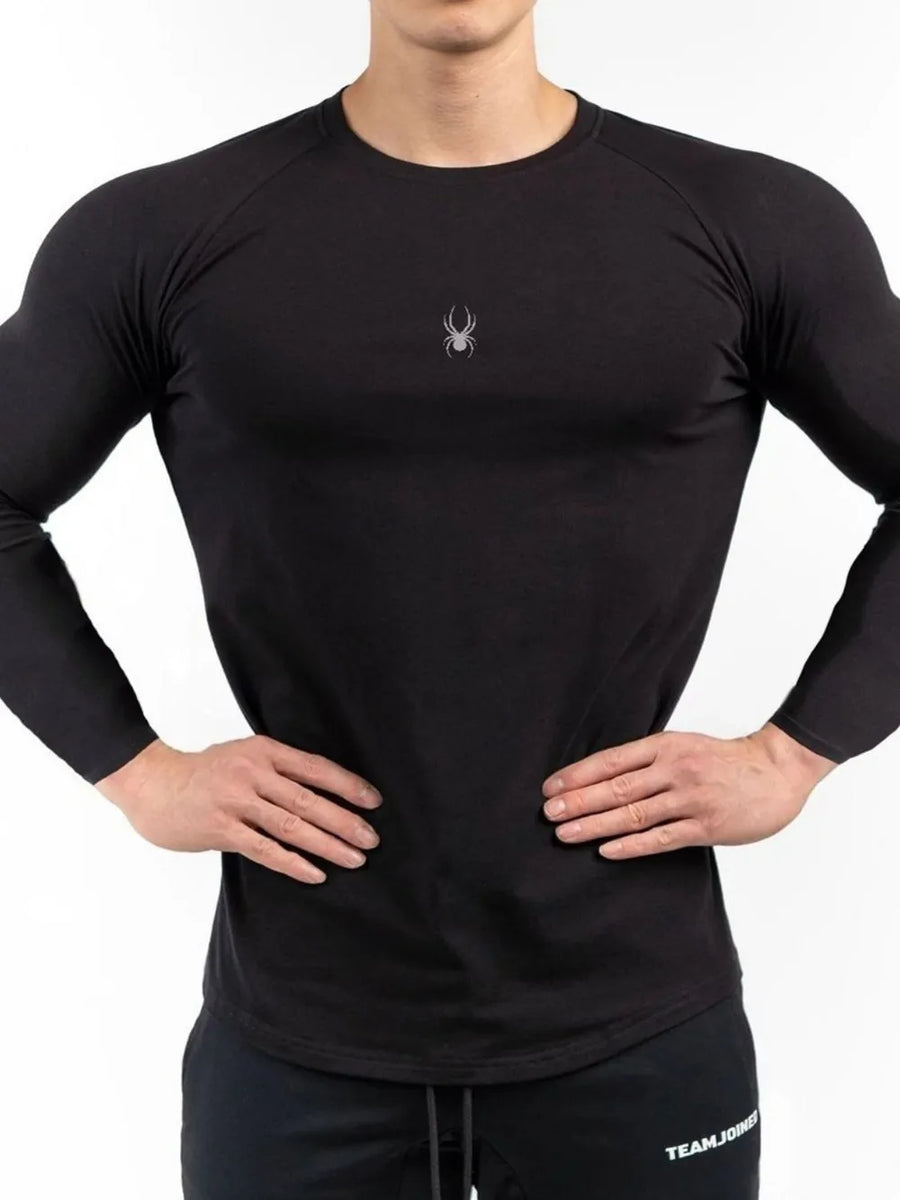 Black long sleeve performance top with crew neck and spider logo detail