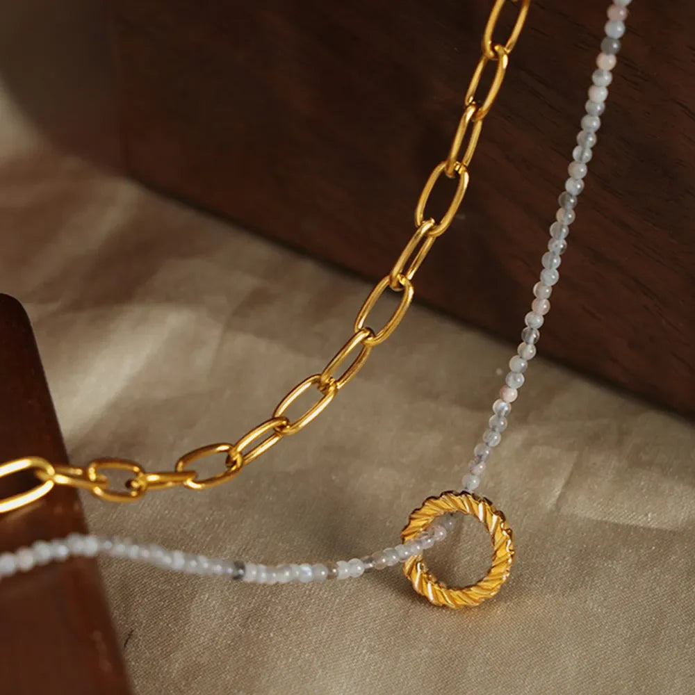 Gold layered chain and beaded necklace with twisted ring pendant