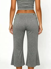 Light gray maternity capri pants with flared hem and button detail