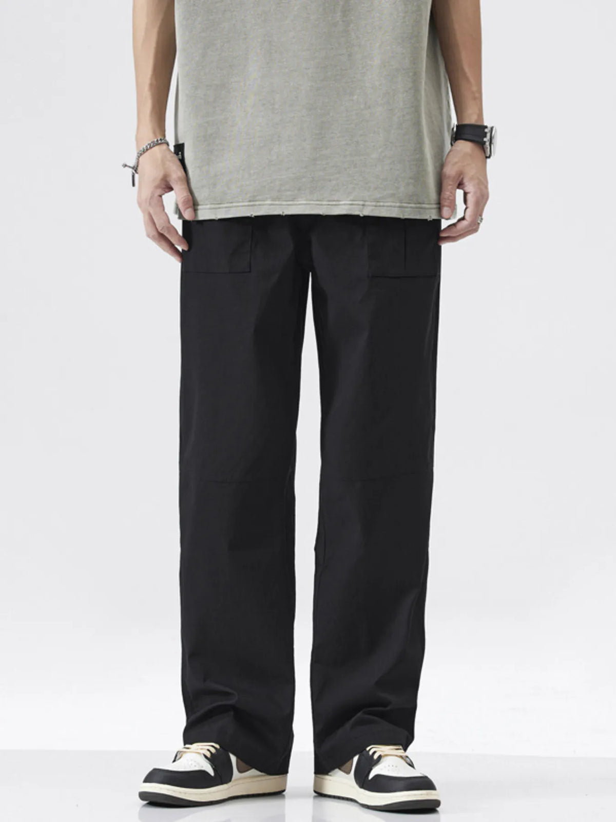 Black casual relaxed fit cargo pants with multiple pockets and a straight leg.