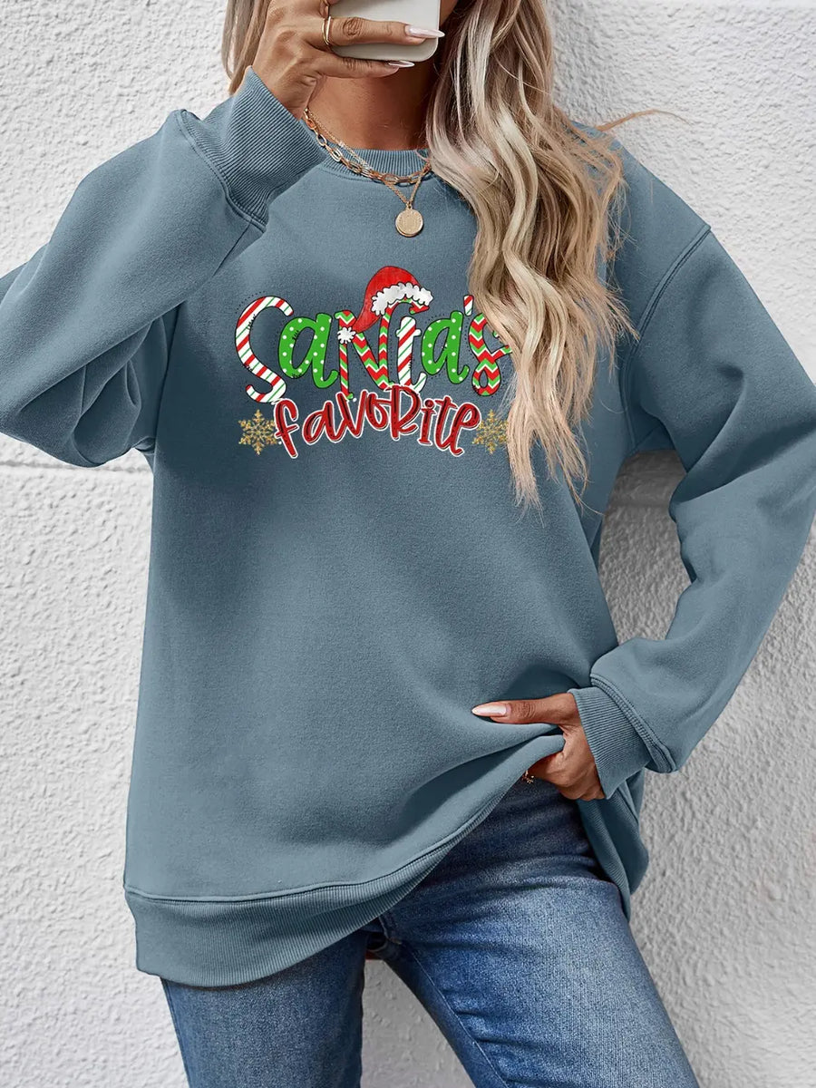 Misty Blue graphic sweatshirt with Santa's Favorite festive print and Santa hat detail.