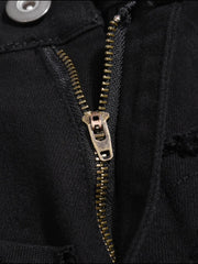 Black denim jeans with frayed edges and a brass zipper detail.