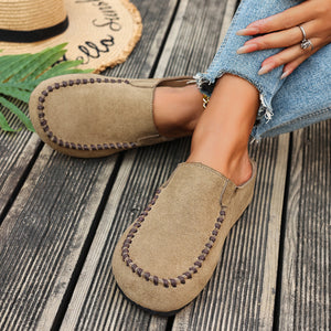Comfortable khaki slip-on flats with decorative stitching detail.
