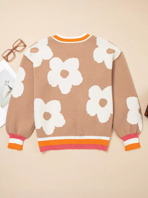 Tan floral pattern baggy sweater with striped cuffs and hem.