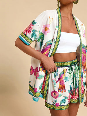 Tropical print cardigan and shorts set with drawstring waist and short sleeves.