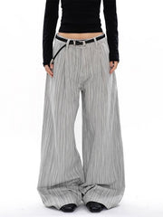 Men's grey striped wide-leg sweatpants with a pleated texture and black belt.