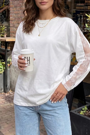 White long sleeve crew neck shirt with delicate lace panel sleeves.