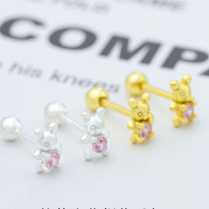 Silver and gold bear stud earrings with pink zircon stones