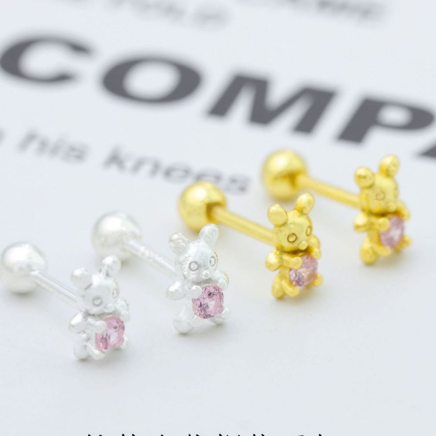 Silver and gold bear stud earrings with pink zircon stones