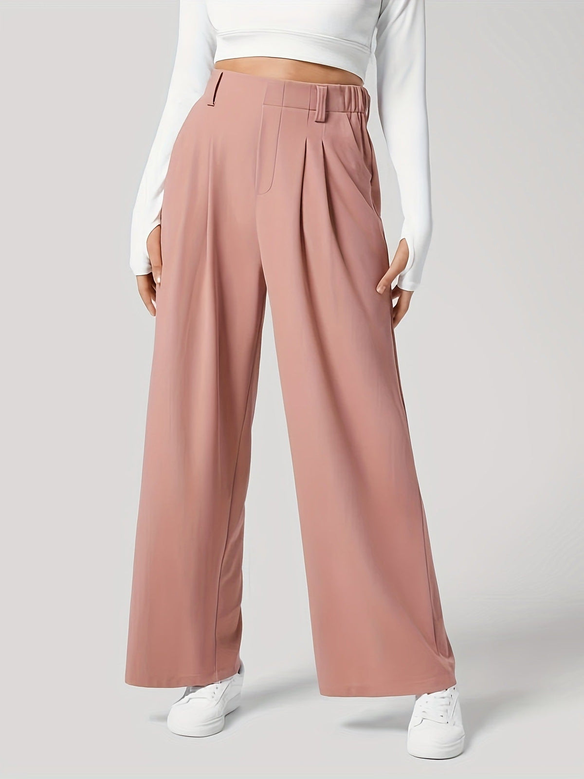 Pleated wide-leg tailored trousers in pale blush, featuring a high waist and relaxed fit.