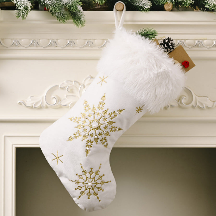 White Christmas stocking with gold embroidered snowflakes and faux fur trim