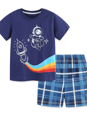 Navy cotton tee with astronaut and rocket graphic, paired with blue plaid shorts.