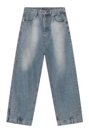 Baggy denim jeans in medium wash with distressed detailing and a wide leg