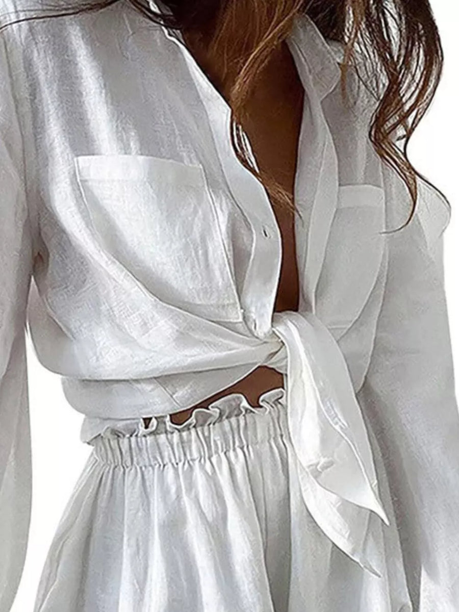 White linen two-piece set with tie-front shirt and ruffled waist shorts