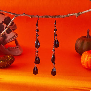 earrings in black with dangle and long