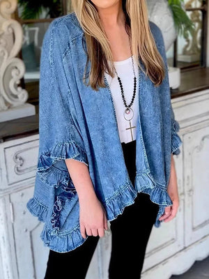 denim jacket in light wash denim blue featuring ruffled and loose fit
