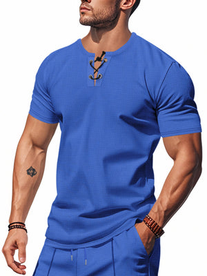Blue cotton t-shirt with V-neck lace-up detail and short sleeves.