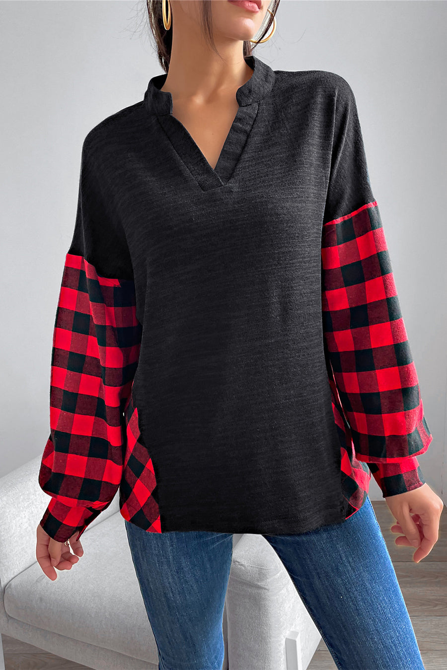 Black henley top with red buffalo plaid balloon sleeves and v-neck