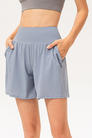 Light blue active shorts with pockets and a wide waistband.