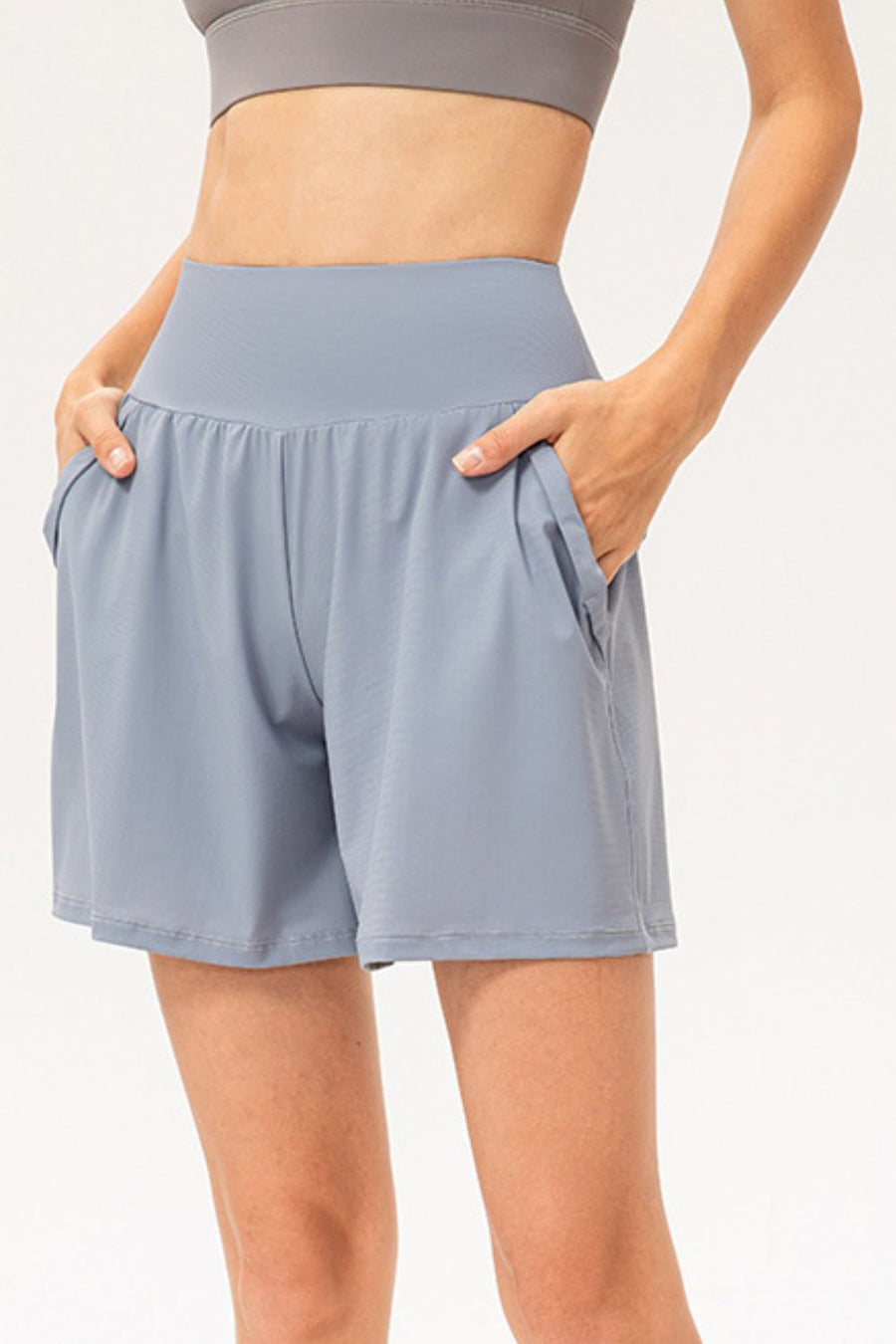Light blue active shorts with pockets and a wide waistband.