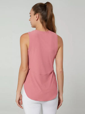 Pink ribbed knit sleeveless top with curved hem