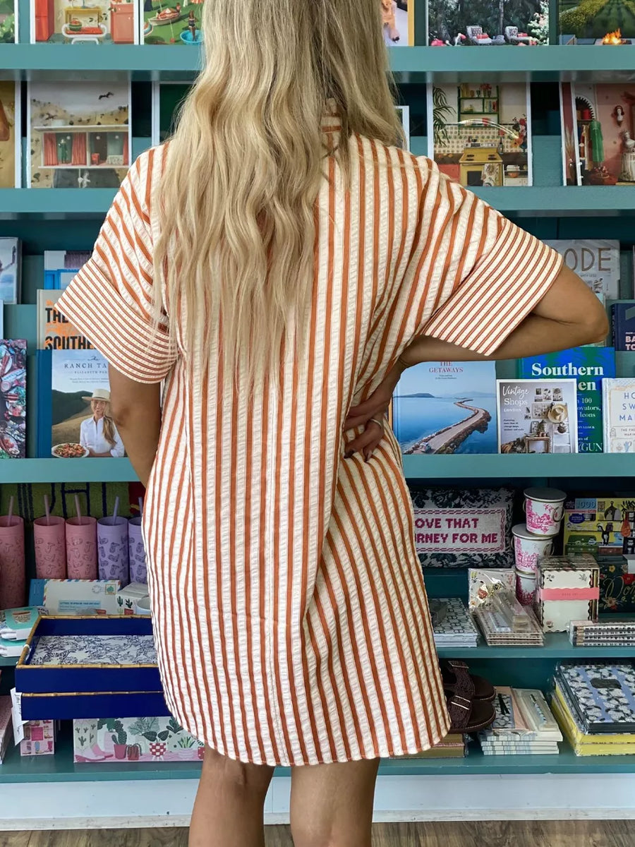 Striped V-neck shift mini dress with short sleeves in a textured fabric.