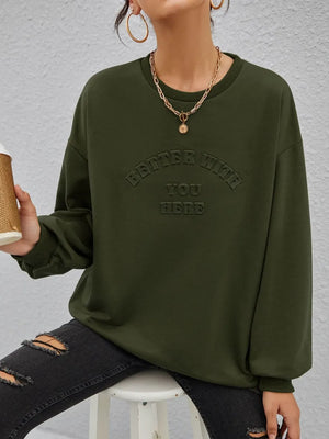 Oversized sweatshirt in Black Forest with embossed text detail and crew neck.