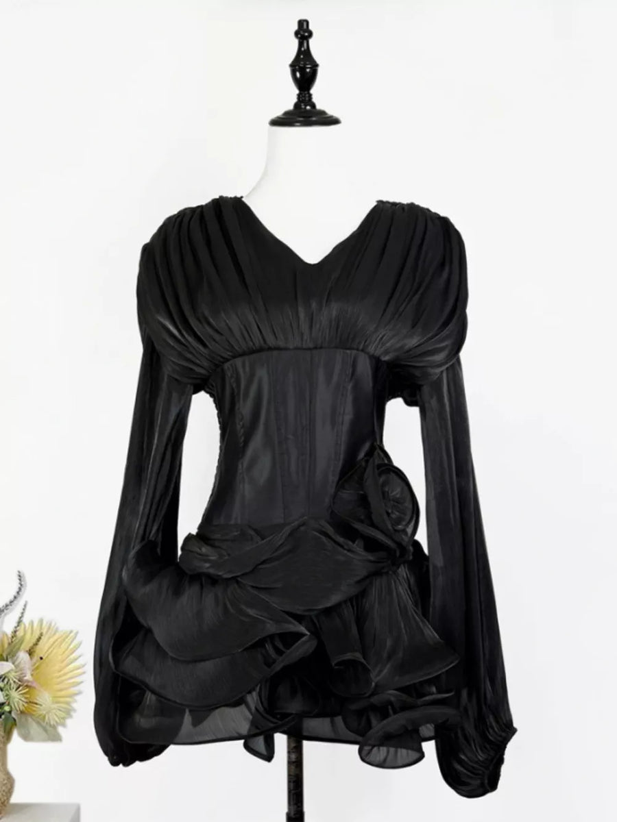 Black ruffled mini dress with corset waist and V-neckline.
