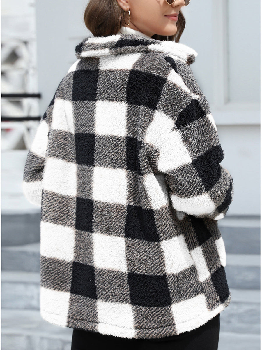 Plaid sherpa overshirt jacket in black and white buffalo check with a fuzzy texture.