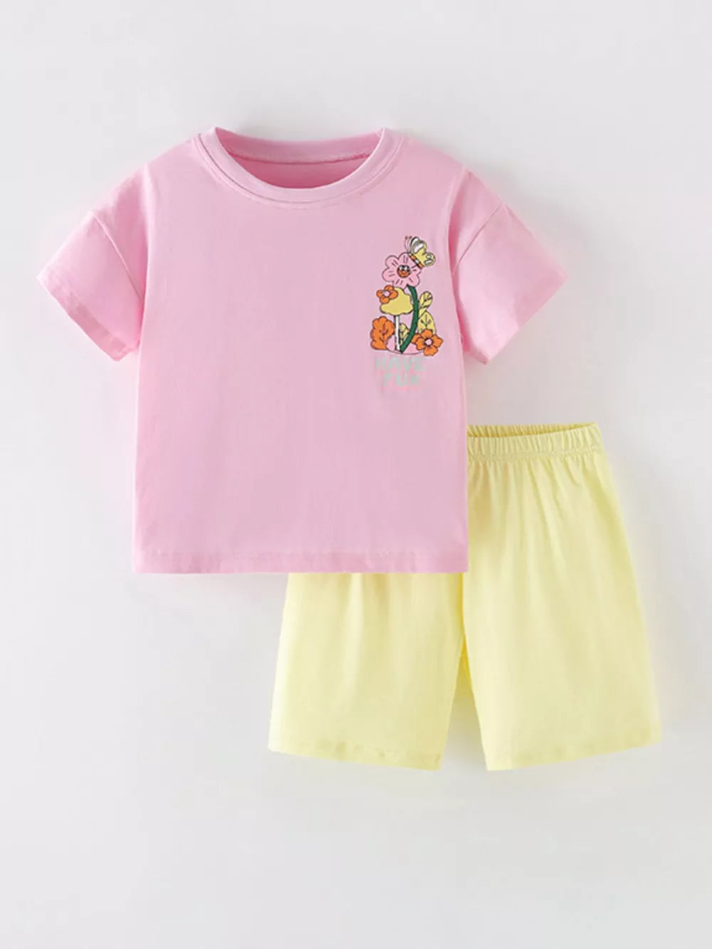 Pink floral graphic t-shirt and yellow shorts set, cotton blend, for girls.