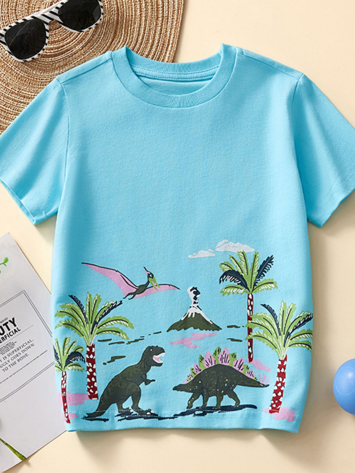 Toddler blue 100% cotton t-shirt with dinosaur adventure graphic print, short sleeves, crew neck.